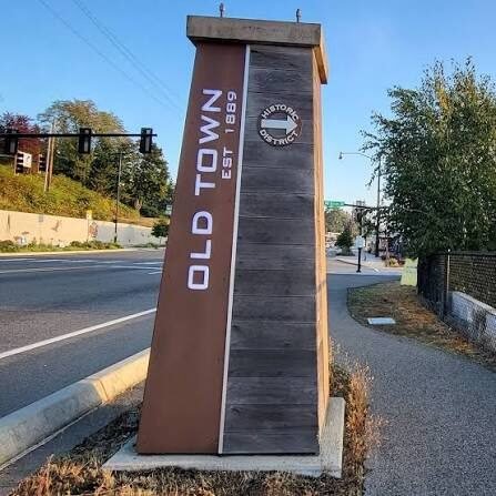 Old Town Silverdale entrance sign beside the sidewalk near Armstrong Injury Law’s office